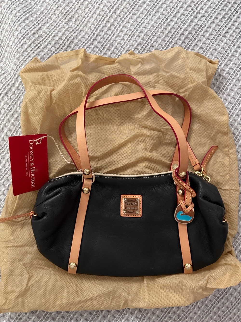 Dooney & Bourke Black Leather Shoulder Bag with Tan Straps and Coral Edge